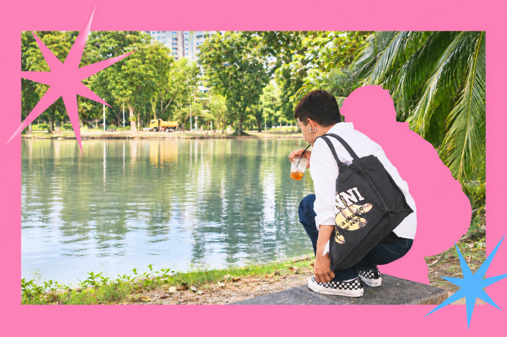 Harris crouching beside a park pond with an iced drink, framed by a bright pink border, a pink silhouette, and starbursts.